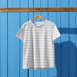 Organic cotton breton t-shirt draped on a wooden hanger